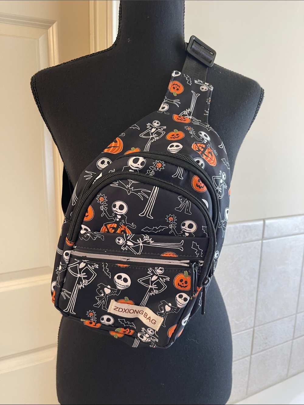 Halloween Jack Skeleton Sling Backpack - Black & Orange
